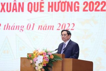 Thủ tướng Phạm Minh Chính phát biểu tại buổi gặp mặt kiều bào dự Xuân quê hương năm 2022. (Ảnh: Dương Giang/TTXVN)