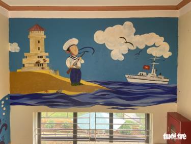 Bức tranh về biển đảo với nét vẽ ngộ nghĩnh phù hợp với các em nhỏ được trang trí trên tường cầu thang khu lớp học mới Trường tiểu học Púng Luông.